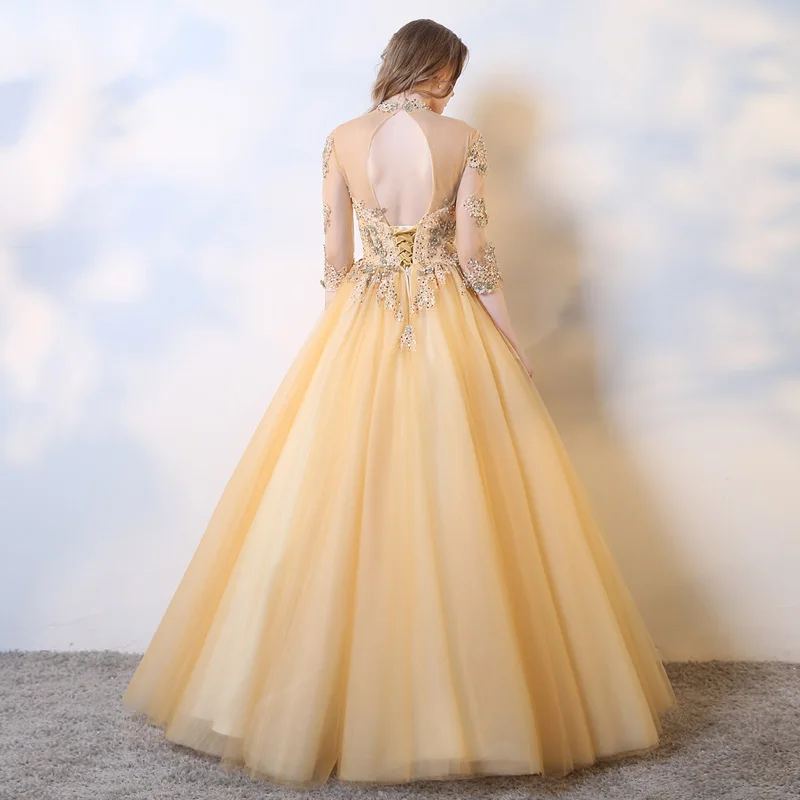 Agora Foremata Gia Eidikh Peristaseis High Neck Gold Tulle Lace Appliques Ball Gowns Quinceanera Dresses With Sleeves Sexy Open Back Puffy Dresses For Prom Gowns