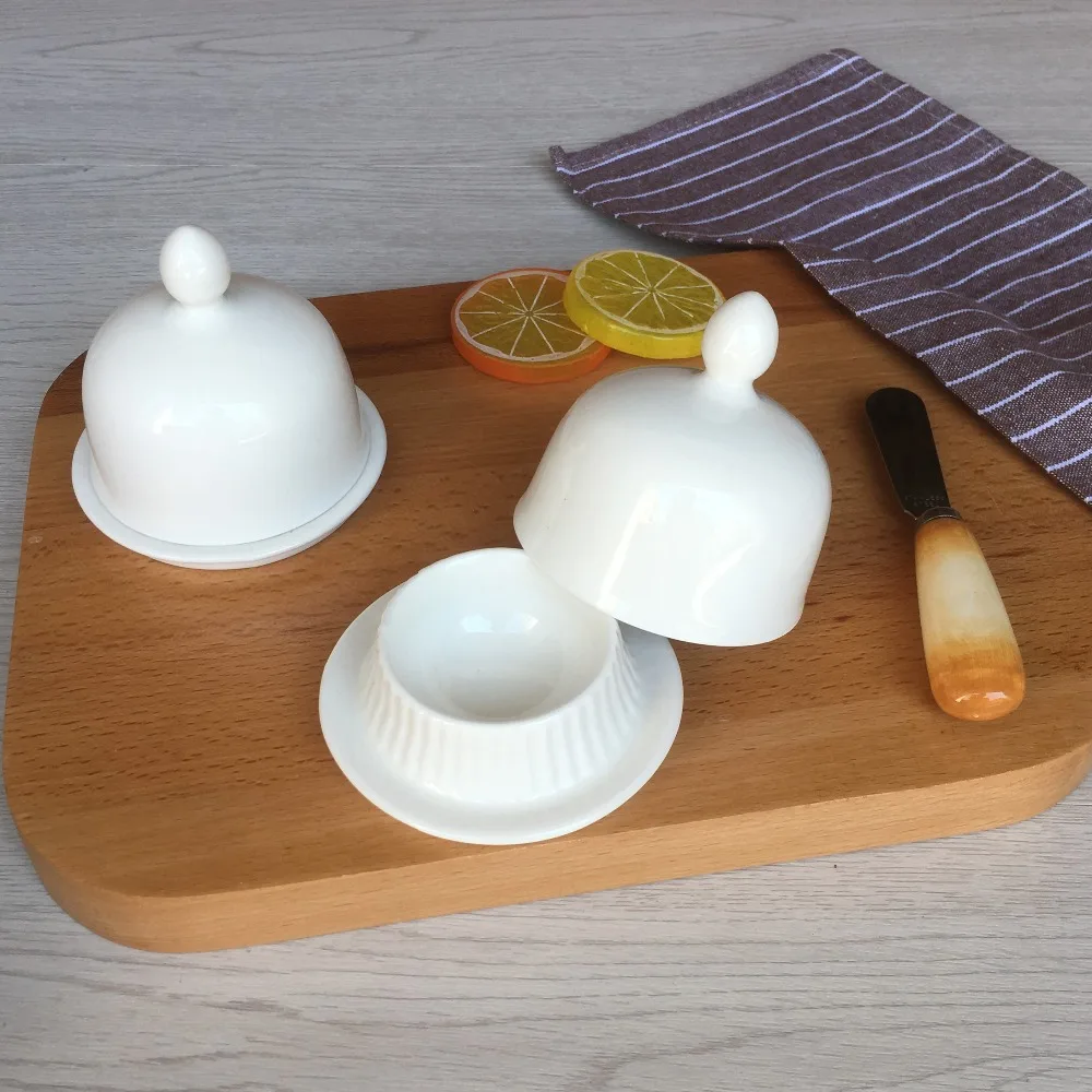 white ceramic butter dish with lid