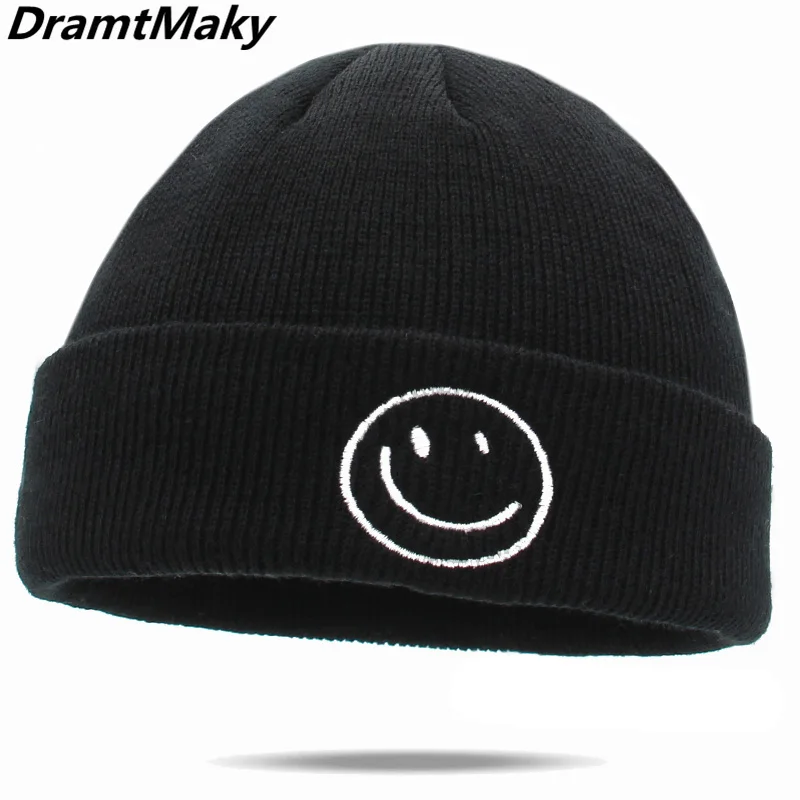 black beanie with smiley face