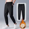 Jodimitty Thicken Sweatpants Winter Men's Plus Velvet Padded Trousers Slim Large Size Warm Pants Solid Trend Sports Jogges M-5XL preview-4